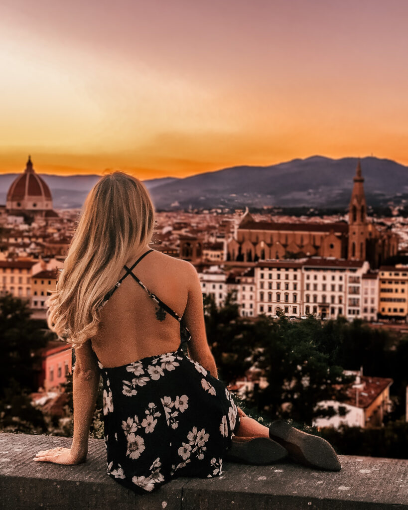 Girl overlooking view at Piazzale Michelangelo in Florence, Italy