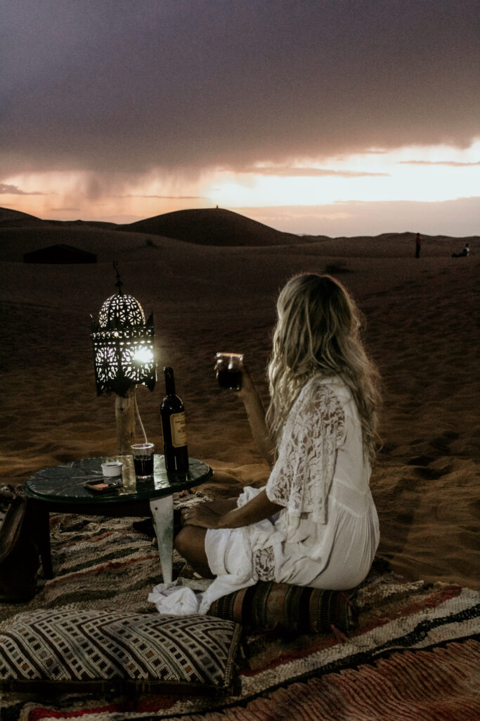 Girl in the desert at night in Morocco. 