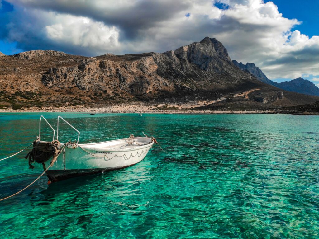 Boating anchoring in water in Crete, Greece