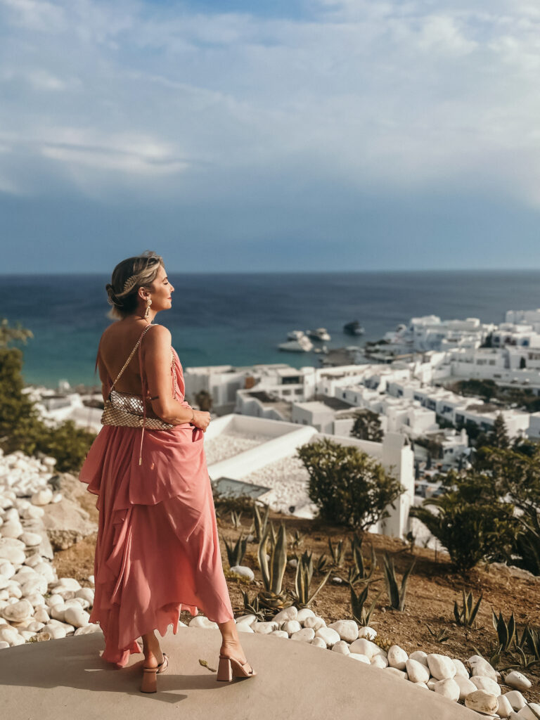 Girl looking out into Mykonos, Greece