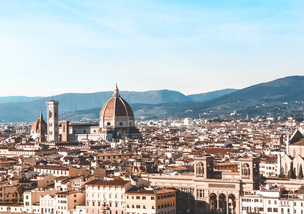 the skyline of florence with a clear blue sky - the boho traveller italy travel guide