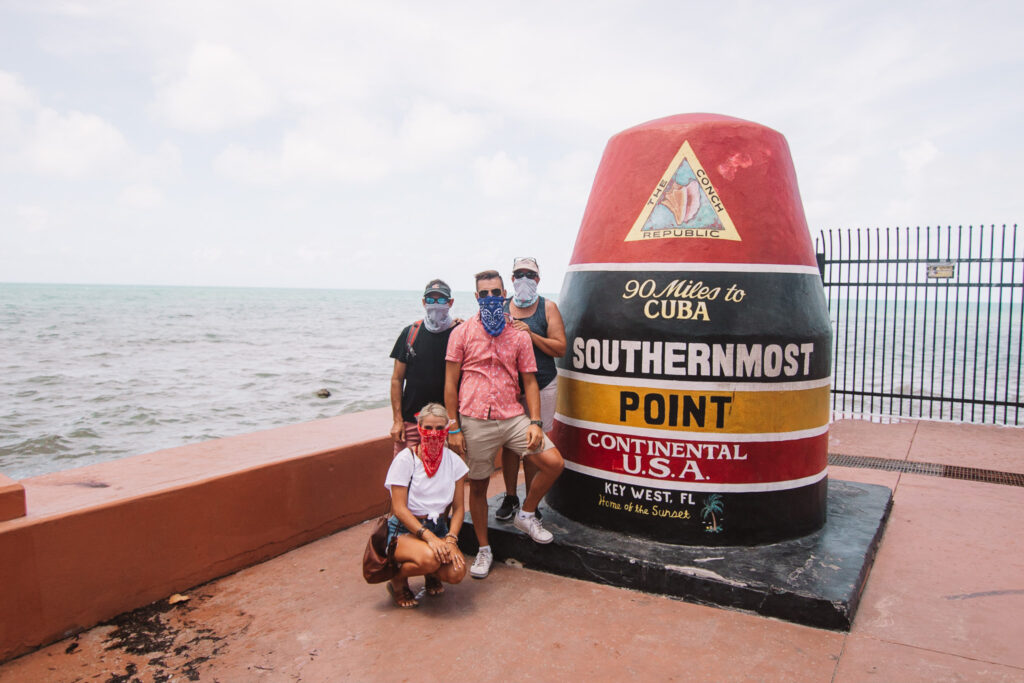 family time at the southernmost point in key west florida - the southernmost point is a bucketlist item thing to do in key west.