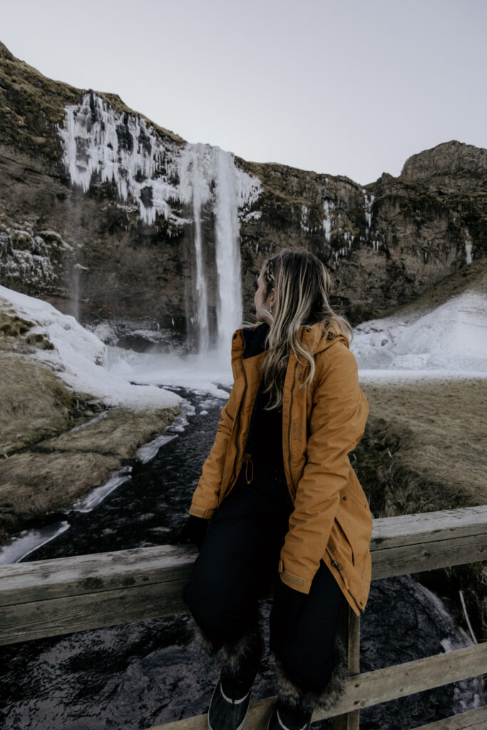 Girl in front of waterfall in Iceland