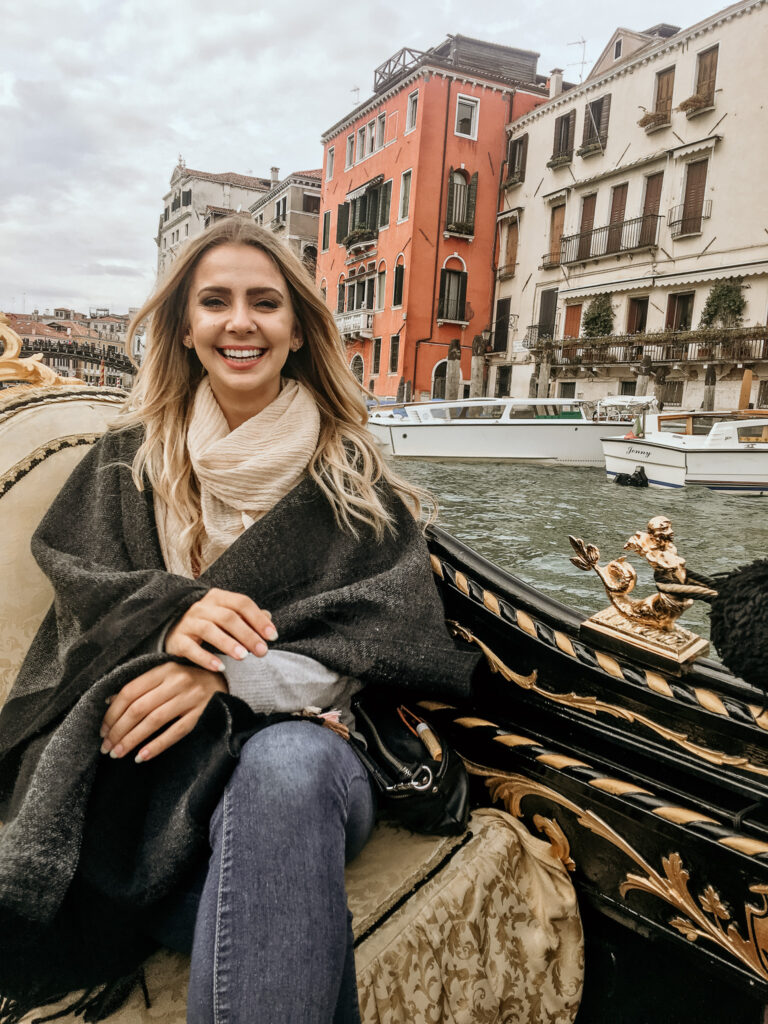 Girl on a gondola ride in Venice, Italy