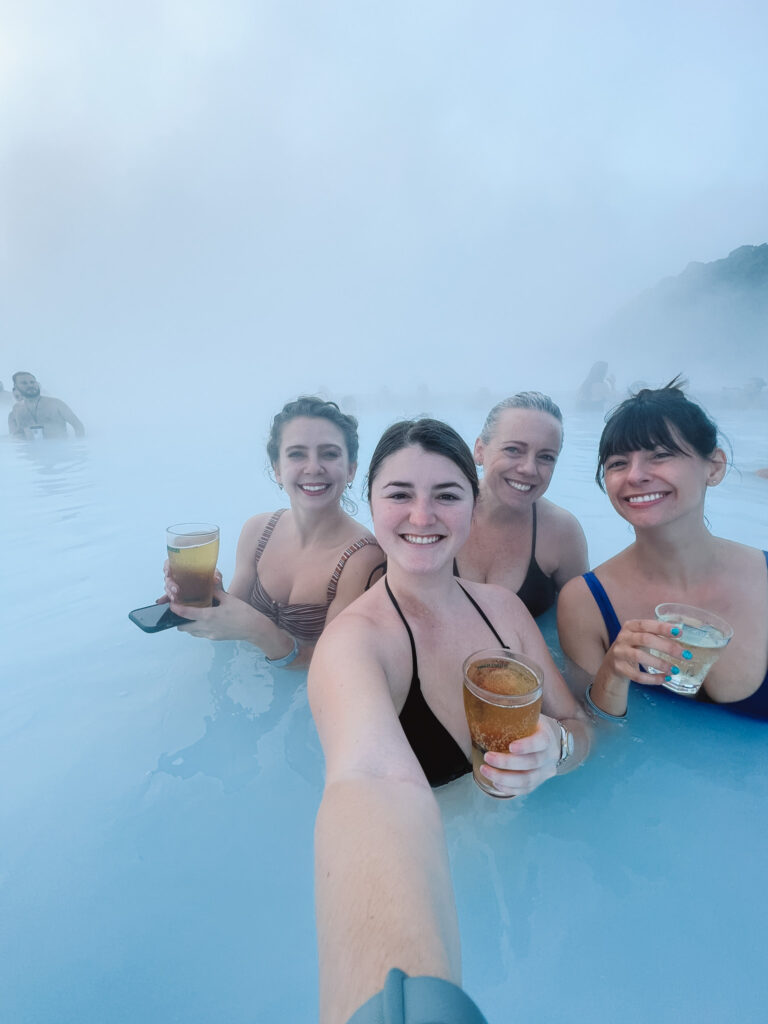 A group of girls enjoying drinks at the Blue Lagoon in Iceland. 