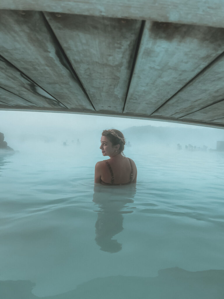 A girl under the bridge at the Blue Lagoon in Iceland. 